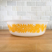 Load image into Gallery viewer, Vintage Glasbake milk glass round lidded 3 quart casserole dish featuring the "Daisy Days" pattern in yellow, with a clear lid. Manufactured either by the McKee or Jeannette Glass Company in the USA, circa 1960s Perfect for storing, serving, and cooking!