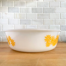 Load image into Gallery viewer, Vintage Glasbake milk glass round lidded 3 quart casserole dish featuring the "Daisy Days" pattern in yellow, with a clear lid. Manufactured either by the McKee or Jeannette Glass Company in the USA, circa 1960s Perfect for storing, serving, and cooking!