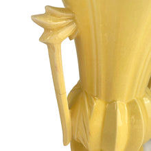 Load image into Gallery viewer, Exceptionally beautiful vintage gloss yellow art deco vase, features a melon base flowing into a trumpet shape finished with leaf topped handles. Crafted by McCoy Pottery, 1948. This rare vase must for any art pottery collector!
In as found vintage condition, no chips//repairs. There is a tight hairline crack on one of the handles and age-related crazing commensurate. Maker's mark on the bottom.
Measures 7 x 9 1/8 inches