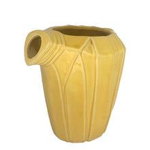 Load image into Gallery viewer, Exceptional vintage gloss yellow art deco leaf wrapped pitcher with strap handle. Crafted by McCoy Pottery, 1949. This rare pitcher must for any art pottery collector!
In excellent vintage condition, no chips/crack/repairs, no noticeable crazing. Maker's mark on the bottom.
Measures 8 x 5 x 7 3/4 inches (incl. handle)
Capacity 55 ounces