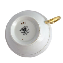 Load image into Gallery viewer, This antique bone china footed teacup and saucer is so sweet! Both the cup and saucer have a lovely scalloped edge, hand painted gold gilt bands over yellow and white glazed porcelain and a gold gilt infinity ribbon dotted in orange. Produced by Royal Albert Crown China, England. Based on the maker's mark, dates to 1927 - 1935. In excellent condition, free from chips, cracks or repairs. Maker's mark on the bottom of both pieces. Teacup is marked with the number 591.