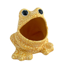 Load image into Gallery viewer, Three-quarter front view of Vintage yellow lava glaze ceramic frog sponge holder, showing wide-open mouth cavity, bulging black eyes, splayed front feet, and all-over pebbled yellow glaze