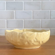 Load image into Gallery viewer, Vintage Art Deco matte yellow glazed Butterfly Line console bowl. Crafted by Nelson McCoy Pottery, early 1940s. This rare piece is must for any McCoy art pottery collector!
In excellent vintage condition, no chips/cracks/repairs. Maker's mark.
Measures 5 1/8 x 3 7/8 x 2 inches