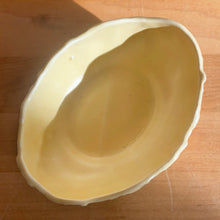 Load image into Gallery viewer, Vintage Art Deco matte yellow glazed Butterfly Line console bowl. Crafted by Nelson McCoy Pottery, early 1940s. This rare piece is must for any McCoy art pottery collector!
In excellent vintage condition, no chips/cracks/repairs. Maker's mark.
Measures 5 1/8 x 3 7/8 x 2 inches