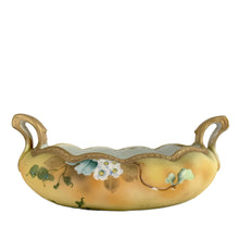 Load image into Gallery viewer, A lovely vintage Nippon oval handled bowl, hand painted in matte yellow, green and ochre featuring clusters of white flowers outlined in white moriage with green leaves. The bowl is finished with a scalloped edge, decorated with detailed gold moriage and gilt. Crafted by artisans in Japan, circa 1920s. A stunning piece!