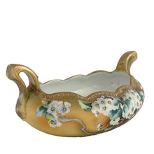 Load image into Gallery viewer, A lovely vintage Nippon oval handled bowl, hand painted in matte yellow, green and ochre featuring clusters of white flowers outlined in white moriage with green leaves. The bowl is finished with a scalloped edge, decorated with detailed gold moriage and gilt. Crafted by artisans in Japan, circa 1920s. A stunning piece!