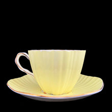 Load image into Gallery viewer, Opposite side profile of vintage EB Foley 1850 scalloped bone china teacup, yellow with floral motif and gold gilt