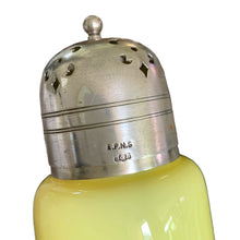 Load image into Gallery viewer, Gorgeous antique Victorian yellow over white cased glass muffineer with pierced silver plate lid. The lid is marked EPNS with S&B inside a shield. Maker was likely Smith & Bartlam, Birmingham, England, circa 1890s. Perfect for sprinkling icing sugar or cinnamon over muffins and desserts. In excellent condition, with age appropriate wear to the silver Measures 3 1/8 x 7 1/8 inches