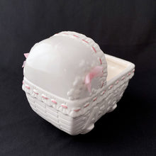 Load image into Gallery viewer, Vintage white and pink ABC bassinet ceramic planter. Crafted by China Ceramic Co., Taiwan, 1970s/80s. Imported by MY-NEIL of Cincinnati, Ohio. Use as a planter, as nursery decor or to store your baby's lotions and accessories. It is simply adorable and the perfect gender reveal accessory to announce your baby is coming into the world!
The ceramics are in excellent condition, no chips or cracks. Measures 5 3/4 x 3 3/4 x 5 1/4 inches