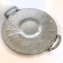 Load image into Gallery viewer, Vintage mid-century hand wrought hammered aluminum handled tray in "Chrysanthemum" pattern. Crafted by Trade Continental, circa 1950s. Pair this fabulous serving tray with a bowl for serving dippable appetizers. A perfect addition to your mid-century serveware collection. In great vintage condition. Measures 14 1/4 inches in diameter