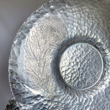 Load image into Gallery viewer, Vintage mid-century hand wrought hammered aluminum handled tray in "Chrysanthemum" pattern. Crafted by Trade Continental, circa 1950s. Pair this fabulous serving tray with a bowl for serving dippable appetizers. A perfect addition to your mid-century serveware collection. In great vintage condition. Measures 14 1/4 inches in diameter