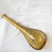 Load image into Gallery viewer, A fabulous amber art glass hobnail patterned genie bottle produced by glass artisans of Guildcraft in the Empoli region of Italy. This superb mid-century piece of art glass would make a unique addition to your home decor collection. Perfect as a decanter, vase or decor piece. Dates between 1950 to 1970. These bottles are incredibly beautiful and highly collectible. In excellent vintage condition, no chips or cracks. Original sticker. Measures 6 x 16 inches