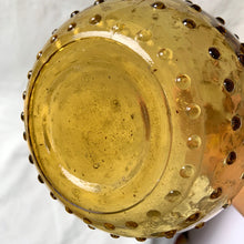 Load image into Gallery viewer, A fabulous amber art glass hobnail patterned genie bottle produced by glass artisans of Guildcraft in the Empoli region of Italy. This superb mid-century piece of art glass would make a unique addition to your home decor collection. Perfect as a decanter, vase or decor piece. Dates between 1950 to 1970. These bottles are incredibly beautiful and highly collectible. In excellent vintage condition, no chips or cracks. Original sticker. Measures 6 x 16 inches