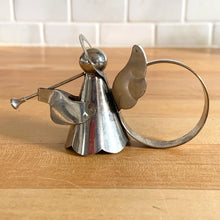Load image into Gallery viewer, Set of six vintage silver trumpeting angel napkin rings. Made in Hong Kong and imported by Eaton's Canada, 1970s. Perfect for Christmas decorating, adding touch of vintage elegance to your holiday table decor!
In used vintage condition with great patina!
Each measures 2 3/4 x 1 1/4 x 2 3/8 inches