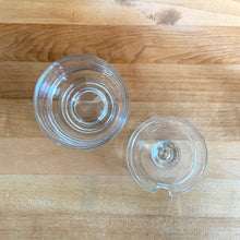 Load image into Gallery viewer, Rare vintage modernist clear glass stackable creamer and covered sugar. Designed by Joe Colombo for Arno, Italy, 1960s. Each piece has a sleek geometric design with a silhouette that makes the contents in this pressed glass appear suspended above the table surface.
Both the creamer and sugar are in excellent condition, no chips or cracks and minimal wear.
Sugar bowl measures 3 3/8 x 3 3/8 x 3 3/8 inches
Creamer measures 4 x 3 3/8 x 3 1/4 inches
