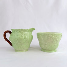 Load image into Gallery viewer, Vintage Australian Design bone china creamer and sugar decorated with raspberry pink foxgloves on a lime green ground. Crafted by Carlton Ware, England, 1930s. A charming addition to your tableware.
In excellent condition, no chips/cracks/repairs. Stamped maker's marks Carlton Ware MADE IN ENGLAND TRADE MARK REGISTRATION APPLIED FOR.
Creamer measures 2 3/4 x 2 5/8 inches and the sugar measures 3 1/8 x 2 1/8 inches