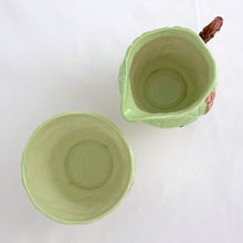 Load image into Gallery viewer, Vintage Australian Design bone china creamer and sugar decorated with raspberry pink foxgloves on a lime green ground. Crafted by Carlton Ware, England, 1930s. A charming addition to your tableware.
In excellent condition, no chips/cracks/repairs. Stamped maker's marks Carlton Ware MADE IN ENGLAND TRADE MARK REGISTRATION APPLIED FOR.
Creamer measures 2 3/4 x 2 5/8 inches and the sugar measures 3 1/8 x 2 1/8 inches