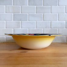 Load image into Gallery viewer, This lovely vintage bowl is hand painted in a rustic style with colourful fruits against a cobalt blue, brown and tan wash ground which is reminiscent of the deep blue sky and farm fields. The bowl is from our personal collection, purchased by my grandmother Rose in the 1930s after she emigrated to Canada. She used this piece as a fruit bowl for many years. In excellent condition, free from chips/cracks. Measures 10" x 2-1/2"