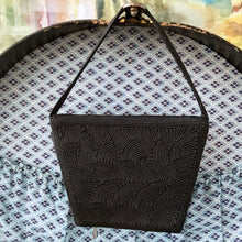 Load image into Gallery viewer, Gorgeous handmade art deco style 1940s vintage black corded evening bag with matching strap and push button closure. The interior is lined with black fabric with a small change purse. The bag is large enough for a small cell phone, credit cards/cash, compact/lipstick. Designed by Jo-Ann Original, made in Canada. A great period piece that would make an fabulous accessory. In overall excellent condition.