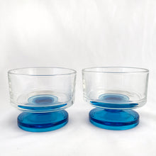 Load image into Gallery viewer, A recent treasure hunt uncovered this stunning set of two (2) mid-century Italian-made footed sherbet glasses (circa 1950-60). The blue is reminiscent of the Mediterranean Sea with its azure coloured water. Imagine eating a scrumptious gelato from these lovelies at a seaside café. They are simply stunning! All are in excellent vintage condition, no chips or cracks. Measures 3-3/8" x 2-3/4"