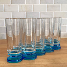 Load image into Gallery viewer, A recent treasure hunt uncovered this stunning set of eight (8) mid-century Italian-made parfait glasses (circa 1950-60). The blue is reminiscent of the Mediterranean Sea with its azure coloured water. Imagine eating a scrumptious tiramisu from these lovelies at a seaside café. They are simply stunning! All are in excellent vintage condition, no chips or cracks. Marked "Italy". Size: 2.25" x 6"