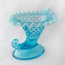 Load image into Gallery viewer, This gorgeous vintage blue hobnail cornucopia candle holder or vase has a lovely crimpaVintage bled opalescent edge. Produced by the Fenton Glass Co. in Williamstown, West Virginia, USA between 1940 - 1954 and 1959 - 1965.  It is perfect as a candle holder or flower vase or could even be used for make-up brushes on a vanity. The glass is a gorgeous light blue with milky opalescent rims that will brighten any room.   Unmarked and in excellent condition, no chips and no cracks.  Measures 5-1/4" x 5" x 5-1/2"