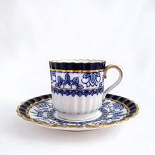 Load image into Gallery viewer, Antique bone china demitasse cup and saucer hand painted in cobalt blue and white florals, geometric band with gold gilt details. The cup has a lovely vertically ribbed or scalloped shape. Crafted by Spode Copeland, England, early 1900s. Gorgeous!
In excellent condition, free from chips/cracks/repairs. Impressed, stamped and painted marks, see photos.
Cup measures 2 x 2 inches, saucer measures 4 1/2 inches