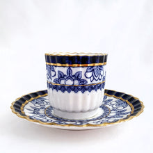 Load image into Gallery viewer, Antique bone china demitasse cup and saucer hand painted in cobalt blue and white florals, geometric band with gold gilt details. The cup has a lovely vertically ribbed or scalloped shape. Crafted by Spode Copeland, England, early 1900s. Gorgeous!
In excellent condition, free from chips/cracks/repairs. Impressed, stamped and painted marks, see photos.
Cup measures 2 x 2 inches, saucer measures 4 1/2 inches