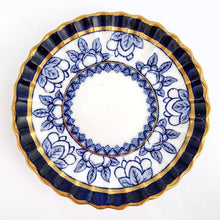 Load image into Gallery viewer, Antique bone china demitasse cup and saucer hand painted in cobalt blue and white florals, geometric band with gold gilt details. The cup has a lovely vertically ribbed or scalloped shape. Crafted by Spode Copeland, England, early 1900s. Gorgeous!
In excellent condition, free from chips/cracks/repairs. Impressed, stamped and painted marks, see photos.
Cup measures 2 x 2 inches, saucer measures 4 1/2 inches