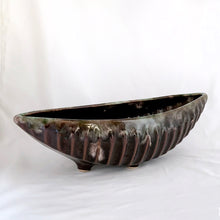 Load image into Gallery viewer, A fantastic large oblong gondola shaped footed pottery planter in brown drip glaze with vertical rib details. Produced by Beaceware, Canada. This unusual 1960s vintage planter would be a beautiful vessel for your favourite houseplants or succulents or use it as a console bowl or catchall. Whatever you choose, it will make a wonderful decorative piece. In excellent condition, free from chips or cracks. Marked "BEAUCE 1756 CANADA" Measures 13 5/8 x 5 1/4 x 4 inches