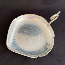 Load image into Gallery viewer, This vintage mid-century modern figural dish in the shape of a leaf features a curled handle a saw-toothed edge. Crafted by BW Buenilum, USA, circa 1950s. Use as a candy dish, or catchall. The perfect additional to your fall decor!  In good vintage condition with some surface marks and normal age-related wear  Measures 8 3/4 x 6 1/2 inches. Maker's mark on bottom.