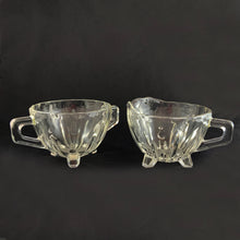 Load image into Gallery viewer, Elevate your tablescape with the fun and effervescent art deco design of this "Burple-Inspiration" creamer and sugar in clear pressed glass featuring curved columns accented with bubbles in graduating sizes. Crafted by Anchor Hocking, USA, circa 1930s. In excellent vintage condition, no chips or cracks. Measures 3 inches