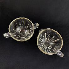 Load image into Gallery viewer, Elevate your tablescape with the fun and effervescent art deco design of this "Burple-Inspiration" creamer and sugar in clear pressed glass featuring curved columns accented with bubbles in graduating sizes. Crafted by Anchor Hocking, USA, circa 1930s. In excellent vintage condition, no chips or cracks. Measures 3 inches