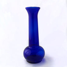 Load image into Gallery viewer, A beautiful hand blown cobalt blue bulb-shaped bud vase, ideal for single stems or a small bouquet. Made in the USA, circa 1970s. In excellent condition, no chips or cracks. Measures 3 x 7 1/2 inches