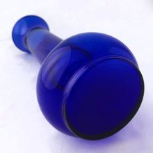 Load image into Gallery viewer, A beautiful hand blown cobalt blue bulb-shaped bud vase, ideal for single stems or a small bouquet. Made in the USA, circa 1970s. In excellent condition, no chips or cracks. Measures 3 x 7 1/2 inches
