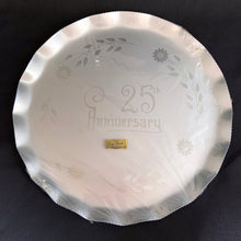 Load image into Gallery viewer, Celebrate that 25th anniversary milestone with this elegant tray, etched by WJ Hughes in 12-petalled Corn Flower pattern. The blank tray was made by Silhoutte, Canada, circa 1970. This gorgeous serving tray would look incredible on a bar cart,  dining table or buffet! Rarely do we find a piece like this in its original packaging. Makes a great gift!  In new condition in the original packaging with the "GENUINE CORN FLOWER BY W.J. HUGHES" sticker still affixed to the wrapper.  Measures 13 inches