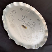 Load image into Gallery viewer, Celebrate that 25th anniversary milestone with this elegant tray, etched by WJ Hughes in 12-petalled Corn Flower pattern. The blank tray was made by Silhoutte, Canada, circa 1970. This gorgeous serving tray would look incredible on a bar cart,  dining table or buffet! Rarely do we find a piece like this in its original packaging. Makes a great gift!  In new condition in the original packaging with the "GENUINE CORN FLOWER BY W.J. HUGHES" sticker still affixed to the wrapper.  Measures 13 inches