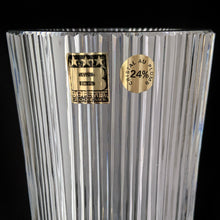 Load image into Gallery viewer, vintage modernist style twenty-four percent lead crystal vase cut in vertical ridges with a band of varying sized circles. The cut circles create an interesting kaleidoscope-like effect. A brilliant piece of art glass designed and executed by artist Josef Pravec, produced for Crystal BOHEMIA in Podebrady, Czechoslovakia, circa 1974. In excellent condition, free from chips, cracks or damage. Signed by the artist on the bottom. Measures 4-5/8" x 13"
