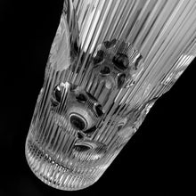 Load image into Gallery viewer, vintage modernist style twenty-four percent lead crystal vase cut in vertical ridges with a band of varying sized circles. The cut circles create an interesting kaleidoscope-like effect. A brilliant piece of art glass designed and executed by artist Josef Pravec, produced for Crystal BOHEMIA in Podebrady, Czechoslovakia, circa 1974. In excellent condition, free from chips, cracks or damage. Signed by the artist on the bottom. Measures 4-5/8" x 13"