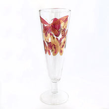 Load image into Gallery viewer, Sip in style with these stunning vintage mid-century era Fred Press footed pilsner glasses decorated in 22kt gold and cranberry pink butterflies on clear Federal Glass blanks, USA, 1950s. Perfect for a cold beer, bubbly champagne or your favourite cocktail or mocktail. These are sure to add a retro glam vibe to your barware!
In excellent condition, no chips.
Measures 2 7/8 x 8 3/8 inches
Capacity 10 ounces