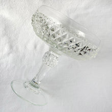 Load image into Gallery viewer, Vintage Diamond Point clear glass compote. Crafted by Indiana Glass, USA, 1970 - 1990. Easily add sparkly elegance to your table or decor with this versatile compote dish. This compote is perfect as a candy bowl, vanity decor or as a catchall.
In excellent condition, no chips.
Measures 6 1/4 x 7 1/8 inches