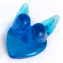 Load image into Gallery viewer, This lovely hand blown azure blue art glass pair of bluebirds perched on a heart was created by artisan Leo Ward in 1992. Mr. Ward was the creator of Arkansas' Bluebird of Happiness and owner of Terra Studios in Arkansas. He passed away at 89 years young in 2017. This piece is in excellent condition, free from chips or cracks. Measures 4" x 4" x 2-1/2"