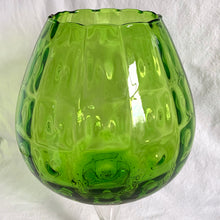 Load image into Gallery viewer, Vintage mid-century hand blown optic art glass snifter features a funky pattern of squares and circles in striking emerald green with a clear stem. Crafted in the Empoli Region of Italy 1950 - 1970, imported by Giftcraft to Canada. The perfect compliment to enhance your MCM decor.
In excellent vintage condition, no chips or cracks. Original sticker.
Measures 8 1/2 x 15 inches