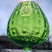 Load image into Gallery viewer, Vintage mid-century hand blown optic art glass snifter features a funky pattern of squares and circles in striking emerald green with a clear stem. Crafted in the Empoli Region of Italy 1950 - 1970, imported by Giftcraft to Canada. The perfect compliment to enhance your MCM decor.
In excellent vintage condition, no chips or cracks. Original sticker.
Measures 8 1/2 x 15 inches