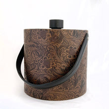 Load image into Gallery viewer, Vintage faux tooled leather ice bucket with floral paisley pattern in brown with black lid and handle. Hammered metal claw tongs included. Produced by Irvinware USA, circa 1970. In excellent condition, free from wear/damage. Measures 7-3/4" x 8-1/2