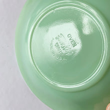 Load image into Gallery viewer, Highly collectible vintage Fire-King "Jane Ray" pressed glass jadeite cup and saucer. Produced by the Anchor Hocking Glass Company, USA, between 1940 - 1970. In excellent condition, free from chips/cracks/repairs. Maker's mark present on the bottom of each piece, see photos. The cup measures 2-3/8" x 1-3/4" and the saucer measures 4-1/8".