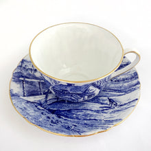 Load image into Gallery viewer, Rare vintage Glorious Devon bone china demitasse cup and saucer features a blue pastoral landscape on white with scalloped shape and gold trim. Crafted by Shelley, England, 1940 - 1966. A charming addition to your china collection!
In excellent condition, no chips. Marked on the bottom with backstamp and the number 12734.
Cup 3 x 1 7/8 inches
Saucer 4 5/8 inches