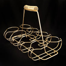 Load image into Gallery viewer, Set of eight mid-century vintage Golden Foliage highball glasses in brass carrying caddy with spiral handle. Produced by the Libbey Glass Company between 1953 - 1978. These glasses will elevate any bar cart and are perfect for any occasion or cocktail! Great vintage condition. The glasses are free from chips/cracks. Minor wear present to the gold on the rim. Each glass measures 2-3/4" x 5-1/2" (12oz)