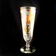 Load image into Gallery viewer, Vintage Golden Foliage pilsner or champagne glass featuring gold leaves on a frosted band bordered by gold bands. Crafted by Libbey Glass, USA, circa 1960s. A fabulous addition to your barware collection.
In excellent vintage condition, no chips.
Measures 3 x 8 1/8 inches