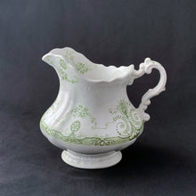 Load image into Gallery viewer, Vintage green transferware pattern on white ironstone creamer. Crafted by J.H.W. & Sons, England, early 20th century. Early English Ironstone is known for its simplicity of design and has been a favourite of collectors for decades. Its simple elegance lends it nicely to many decor styles including shabby chic, cottage, victorian, farmhouse, industrial and everything in between.
In vintage condition, two chips to the foot, no cracks. Stamped on the bottom.